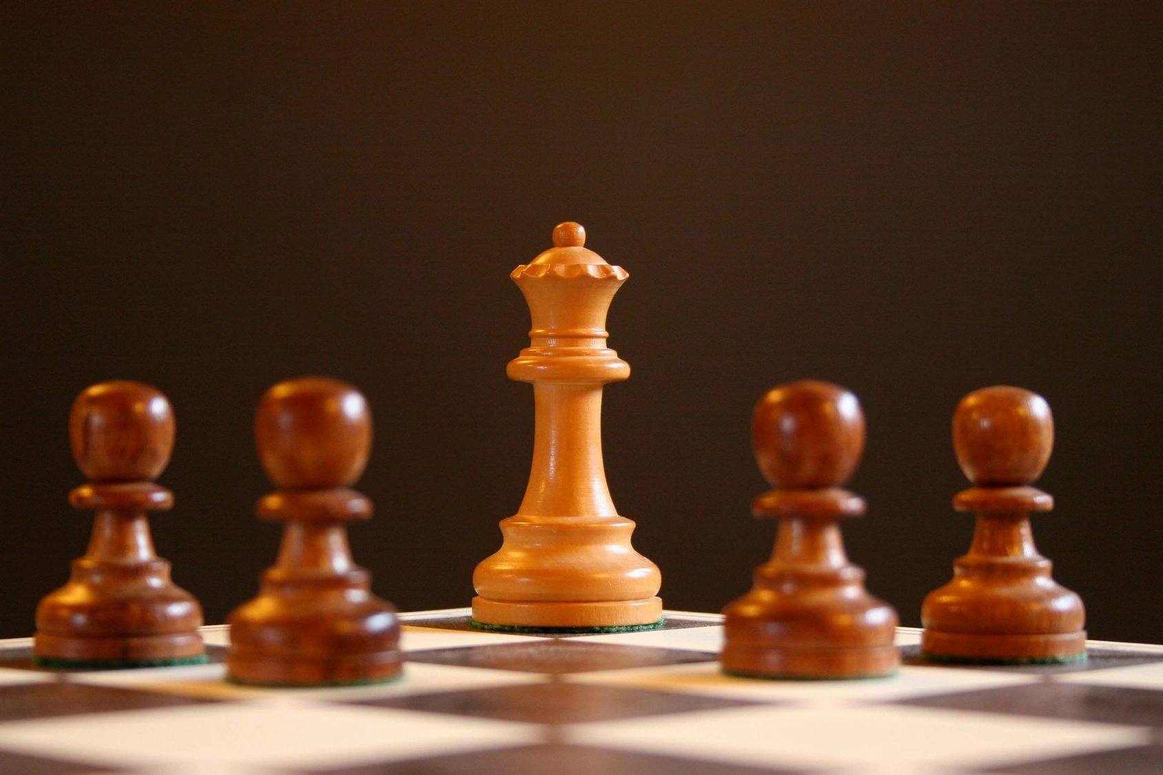 Chess queen piece representing strategy and management