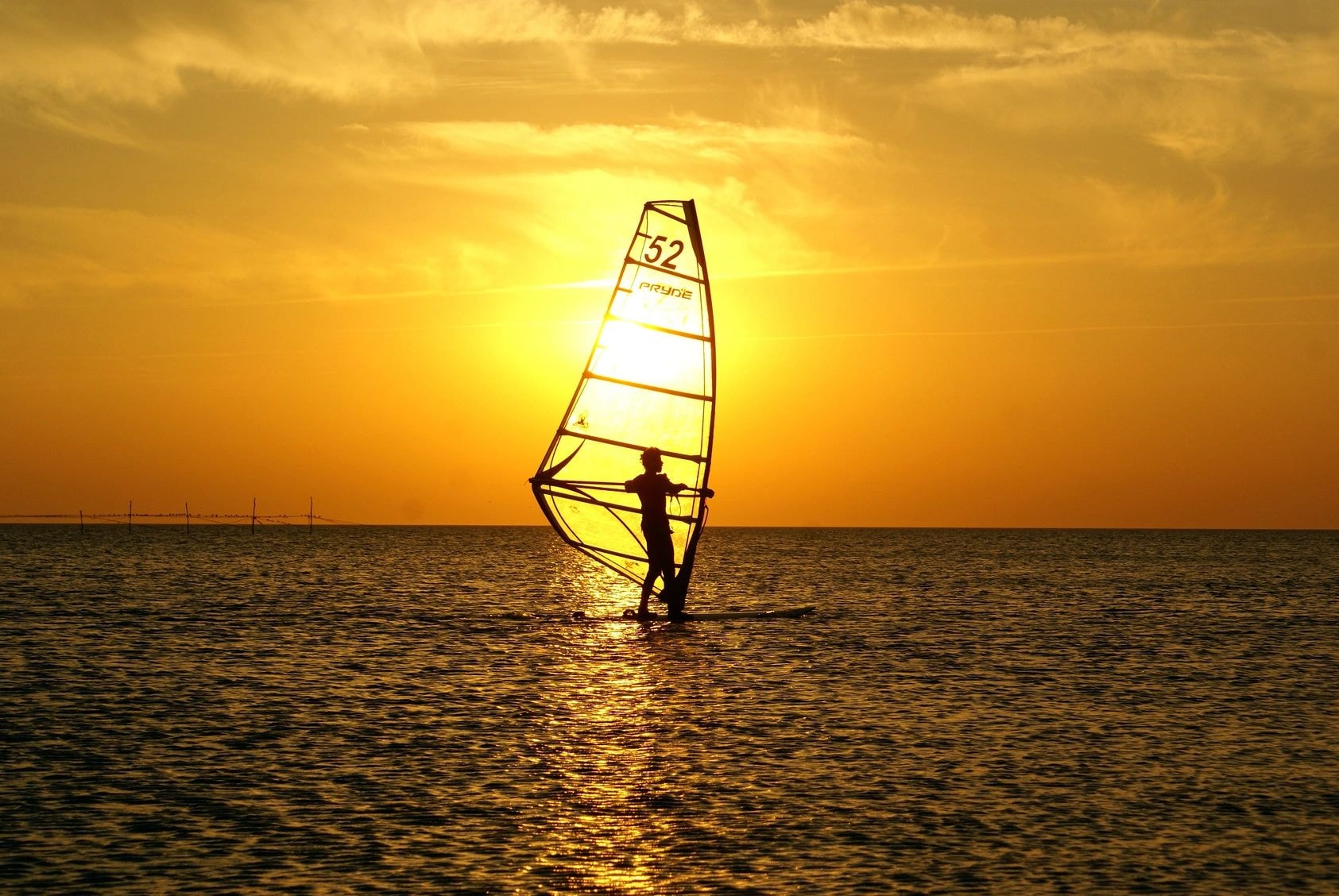 Windsurfer at sunset in Hawaii
